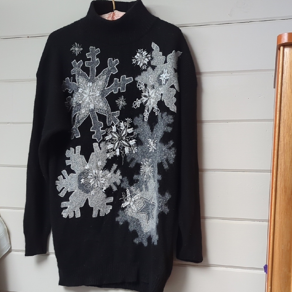 Elegant Black Turtleneck Sweater with Silver Snowflake Design